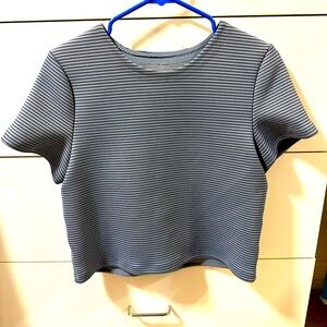 Lululemon top in size 6. Slightly cropped. Short sleeve.